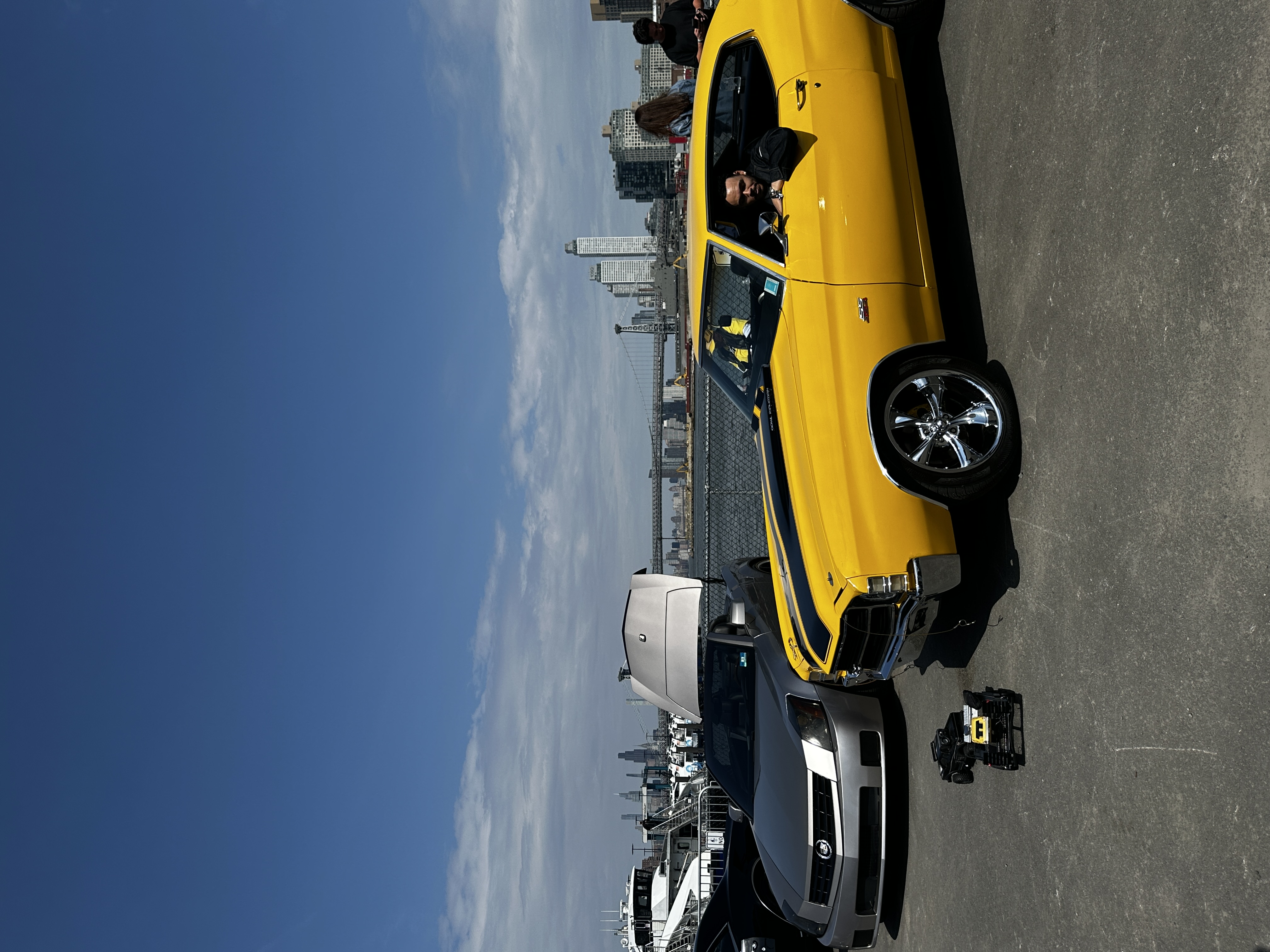 two cars in front of the hudson river