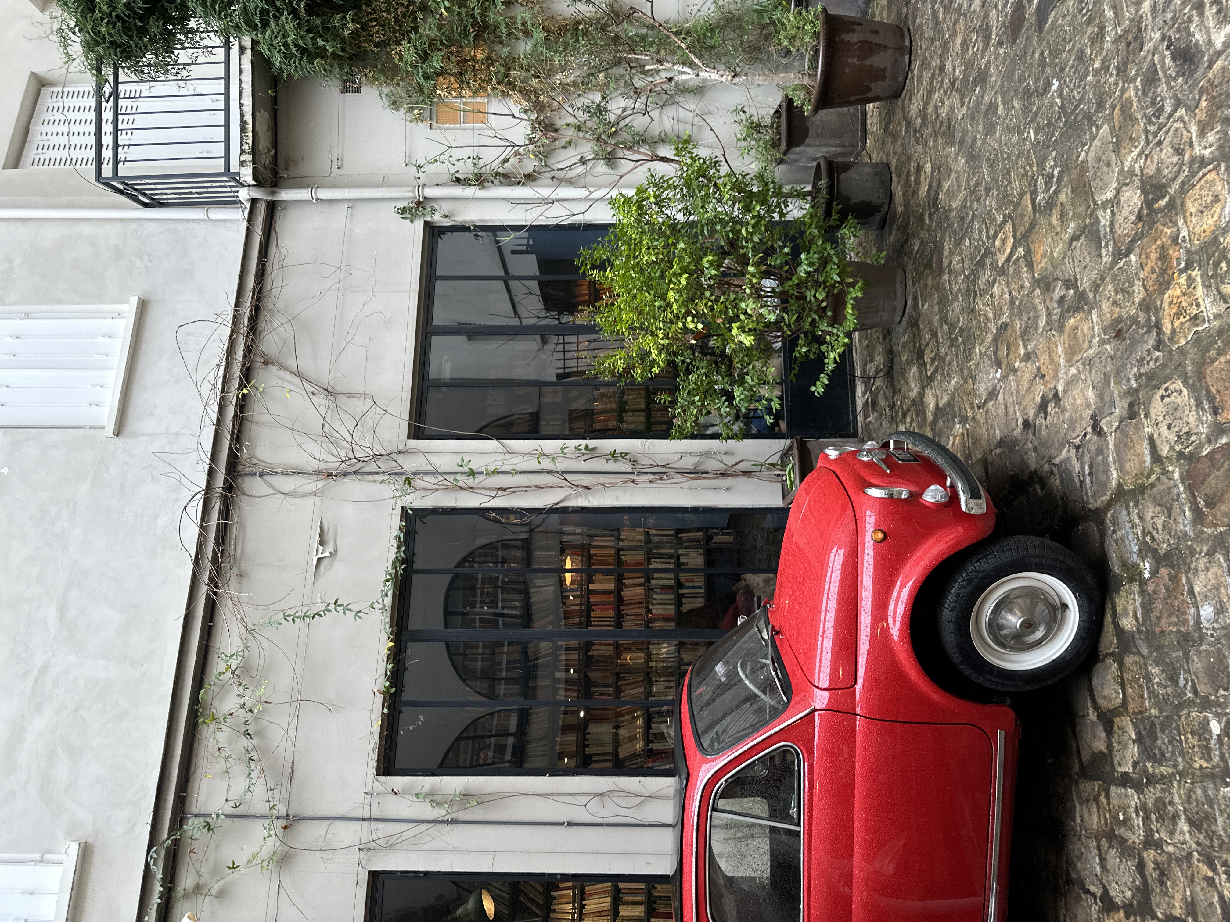a small red car in a courtyard